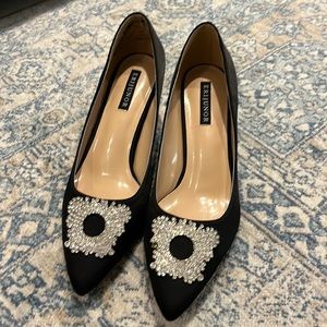 Black satin pumps with rhinestone decor